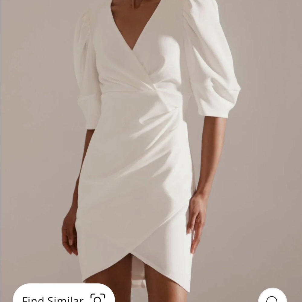 Krisa Crepe Wrap Puff Sleeve Dress
In Ivory 

Size smalll new with tags